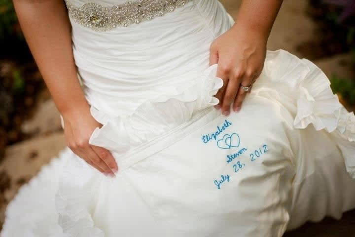 Sewing names into the dress
