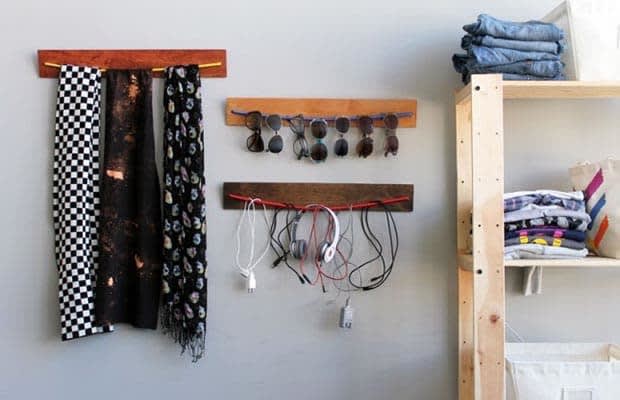 Instead of tossing them into your closet, use bungee cords to hang small items like sunglasses and scarves.