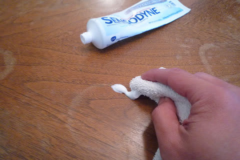 Use toothpaste to get rid of water marks on wood