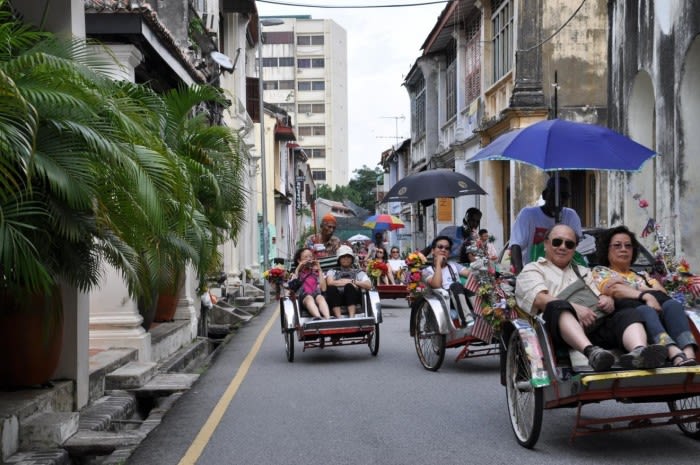 Hop on a trishaw for a tour of George Town