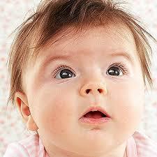 Begins to follow things with eyes and recognize people at a distance