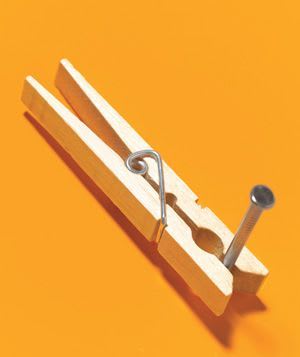 Use a clothespin to hold a nail while hammering