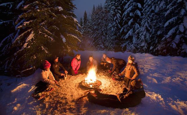 Warm yourself around a campfire