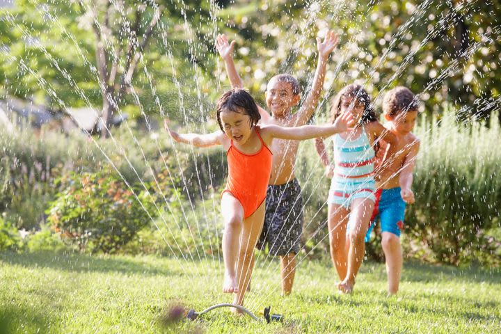 Play in a sprinkler