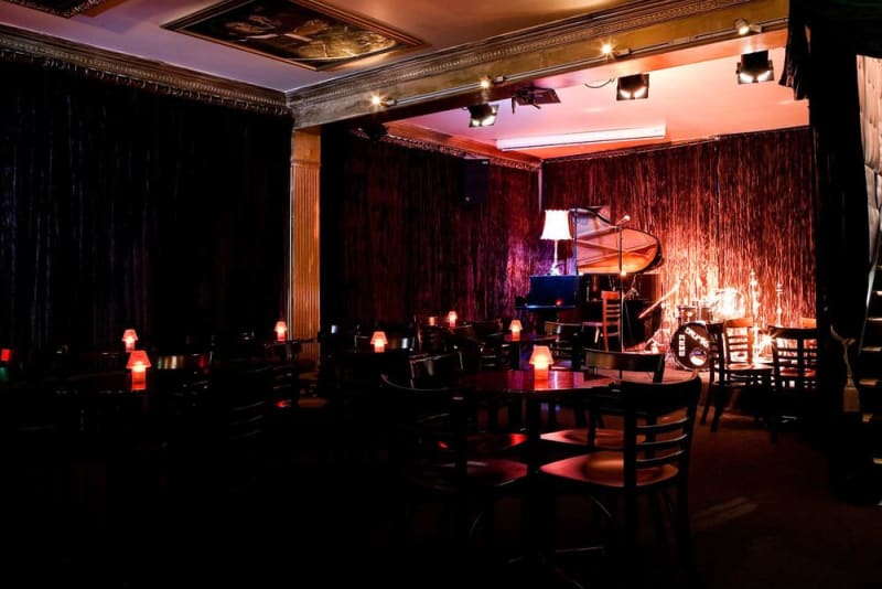 Attend a jazz performance at the Paris Cat Jazz Club
